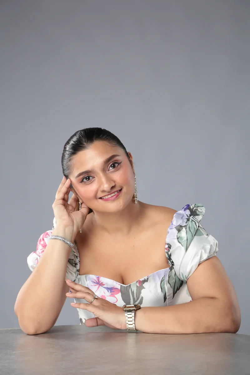 Portrait of Radaba Polo wearing a floral dress
