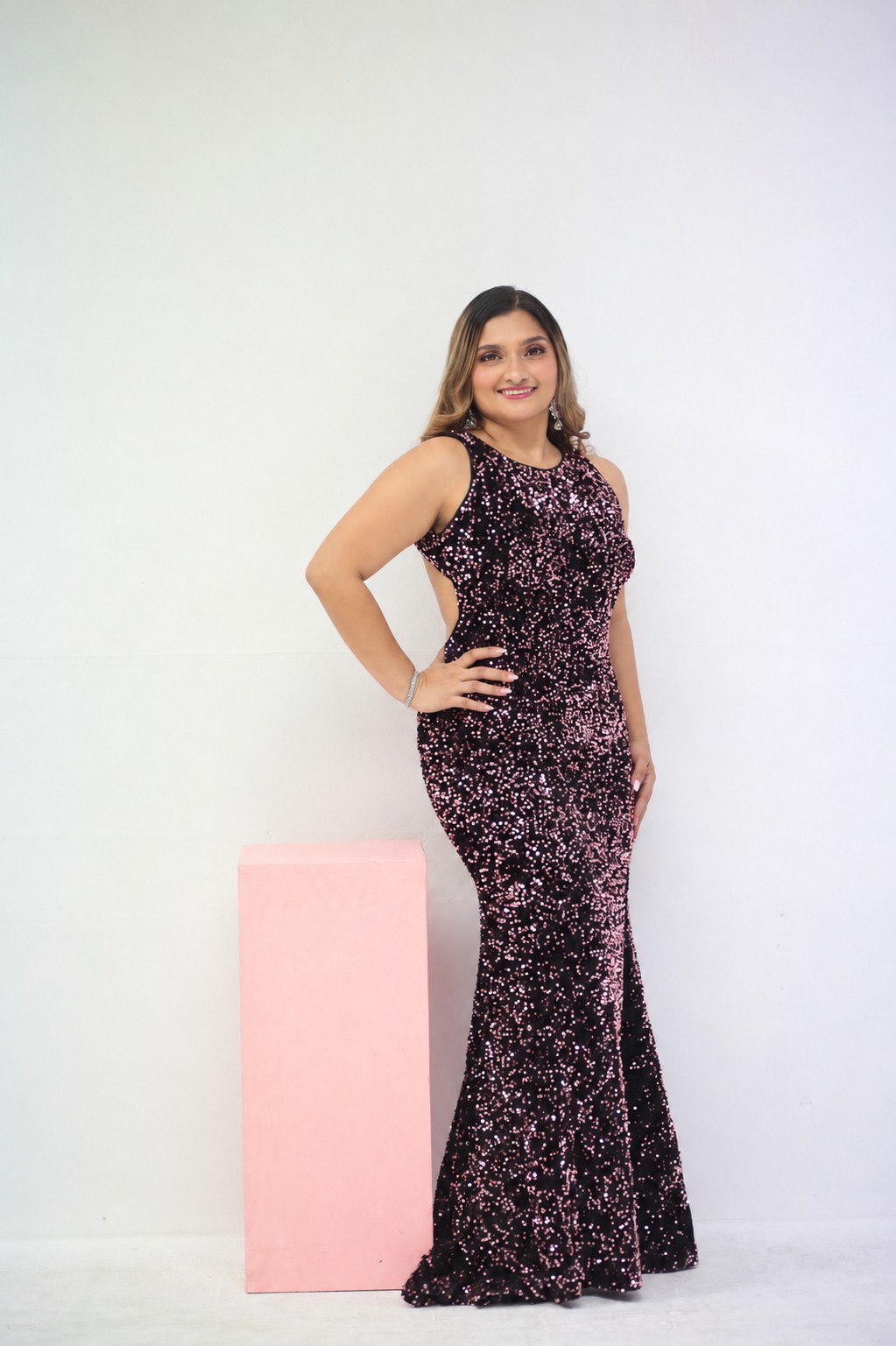 Radaba Polo in a sparkling pink and black gown